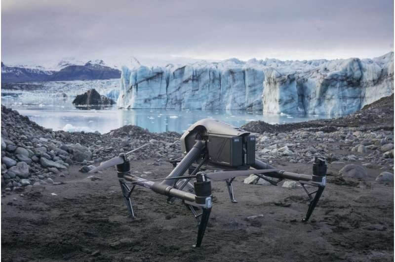 Drone capturing 3D mapping of glaciers to study climate change and environmental impact over time.