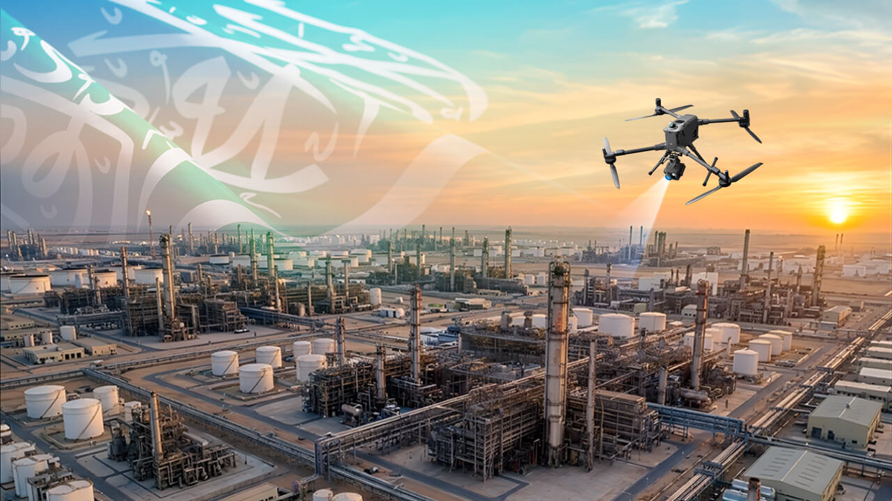 Industrial UAV drone flying over an oil refinery in Saudi Arabia at golden hour